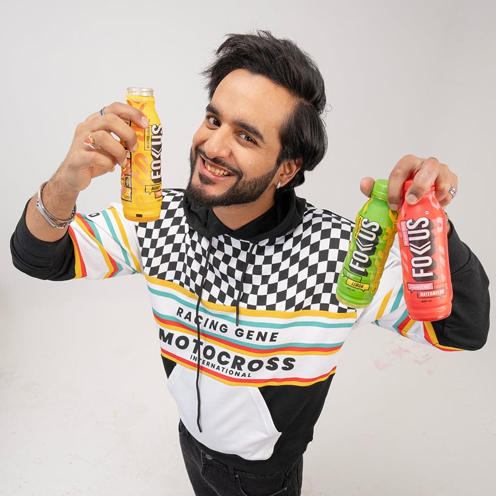 Abhishek Malhan holding a Fokus bottle during 